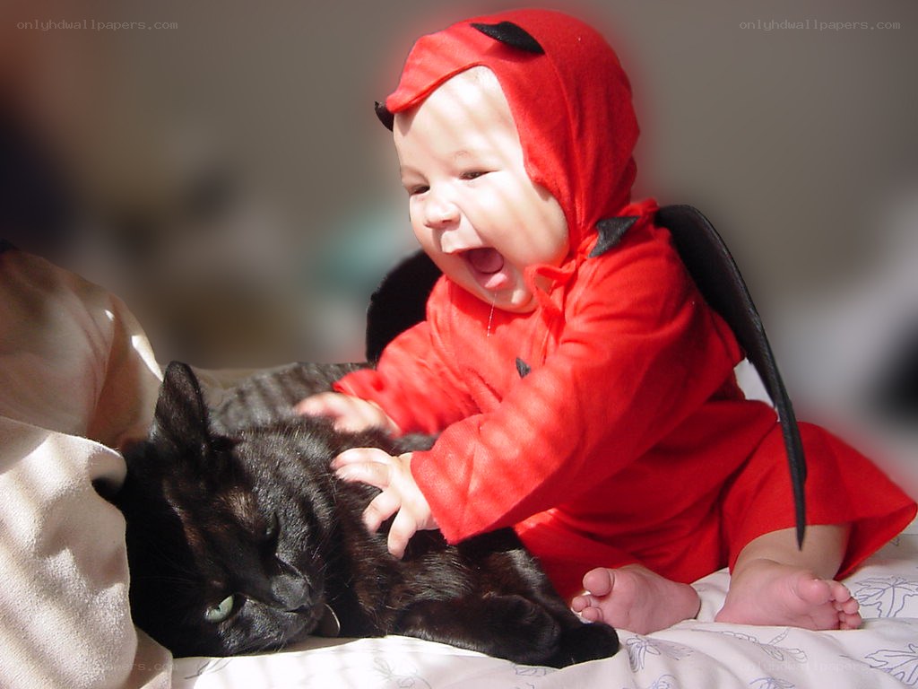 Baby in devil costume with cat