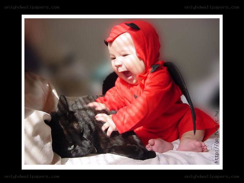 Baby in devil costume with cat