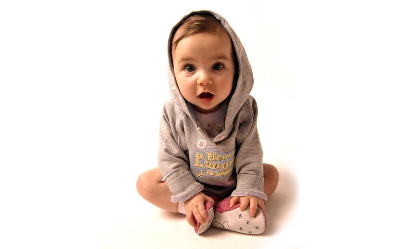 baby in gray hoodie sitting