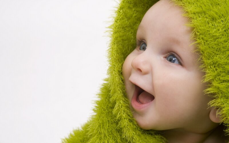 baby in green hood