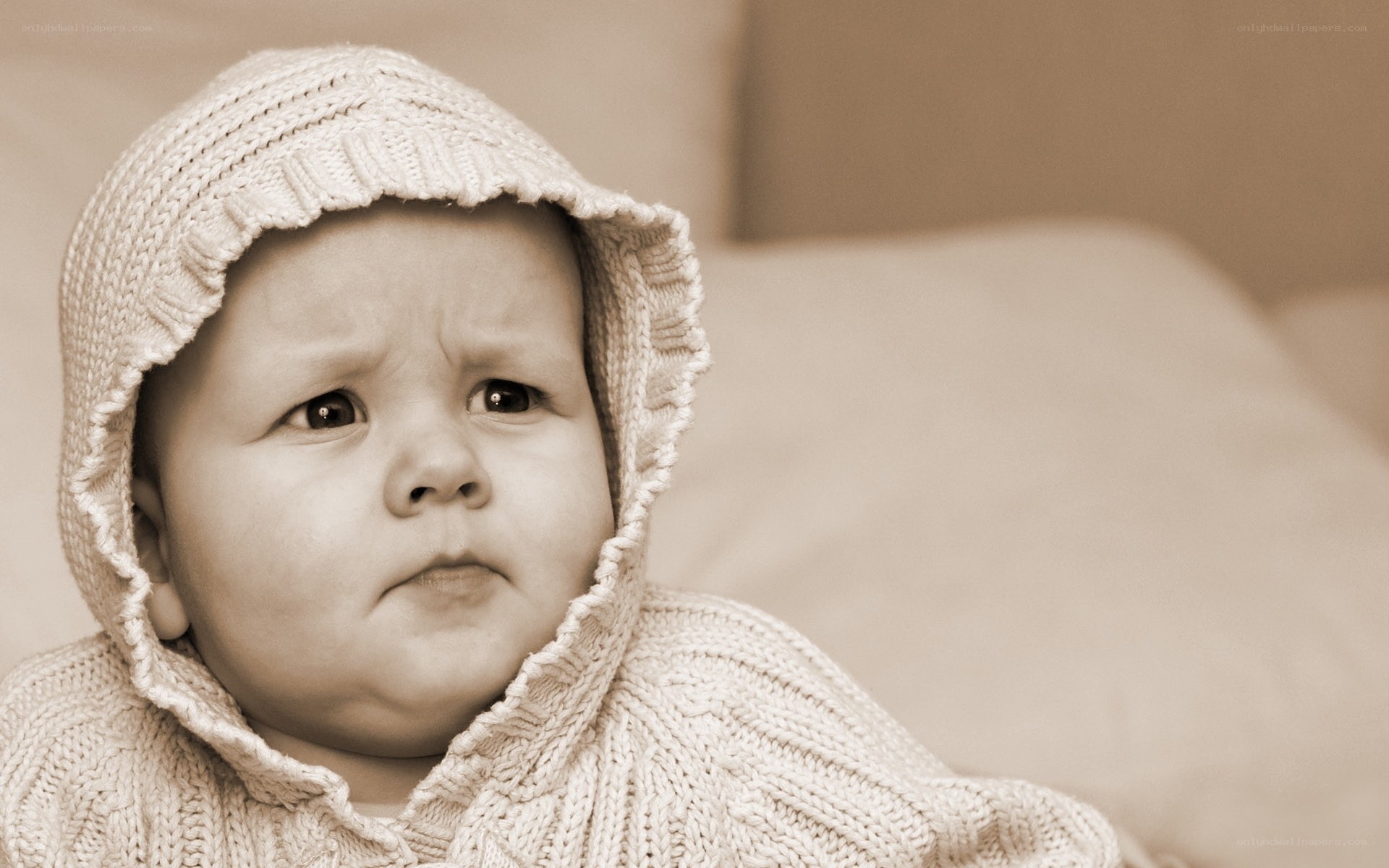 Baby in knitted hood