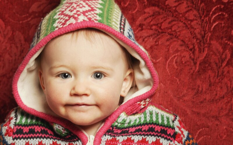 baby in knitted hoodie