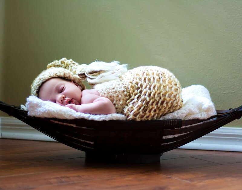 Baby in Knitted Outfit