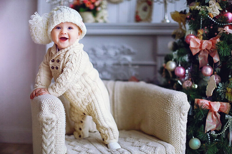 Baby in Knitted Outfit — White, Festive