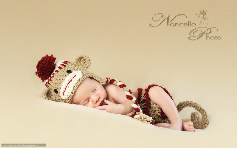 Baby in monkey hat sleeping