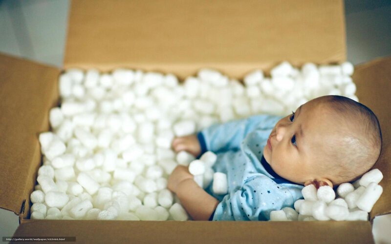 baby in packing peanuts