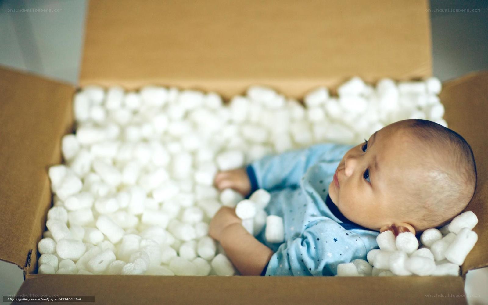 baby in packing peanuts