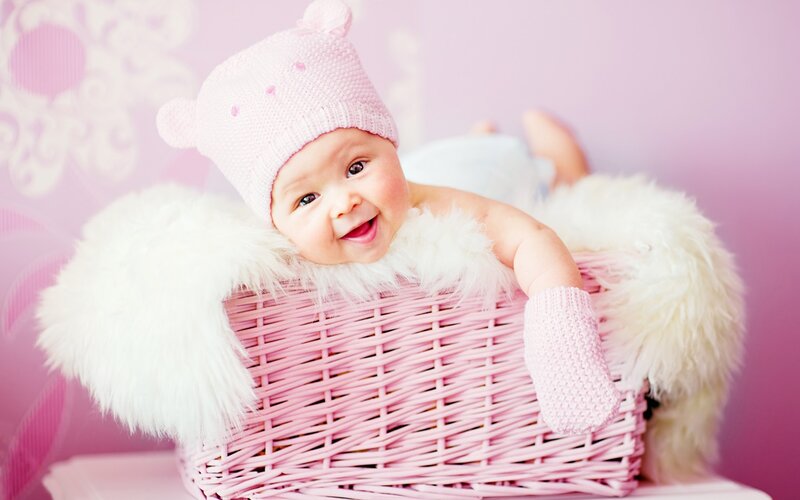 Baby in Pink Basket — Happy