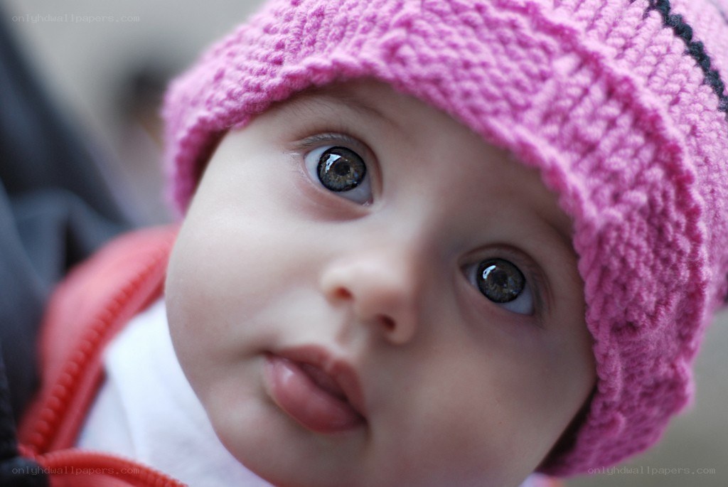baby in pink hat