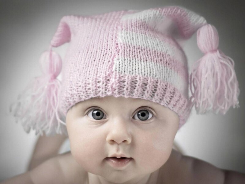 Baby in pink knitted hat