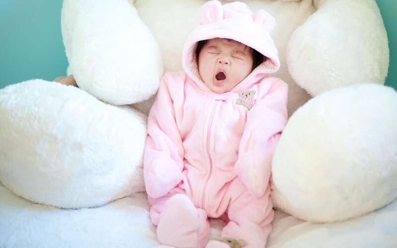 Baby in Pink Onesie — Calm, Photograph