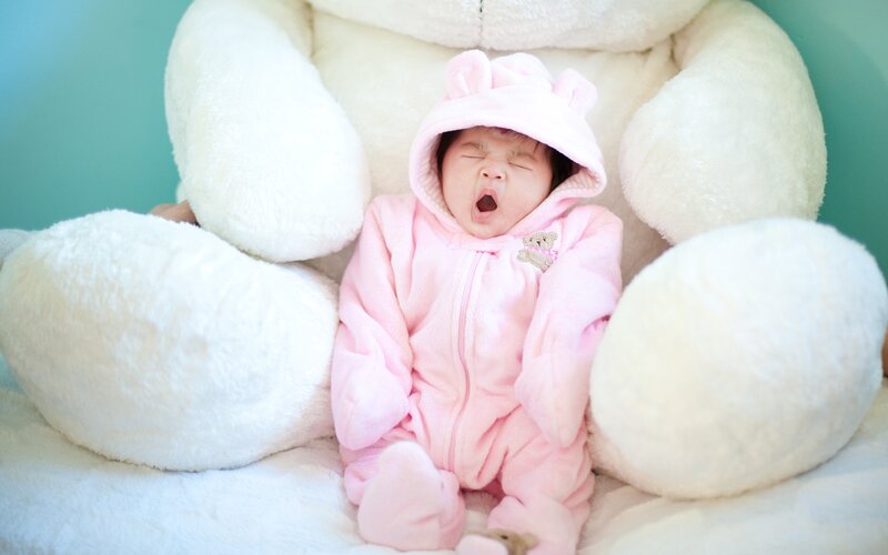 Baby in Pink Onesie — Calm