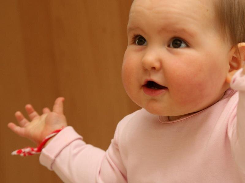 Baby in Pink Onesie — Neutral