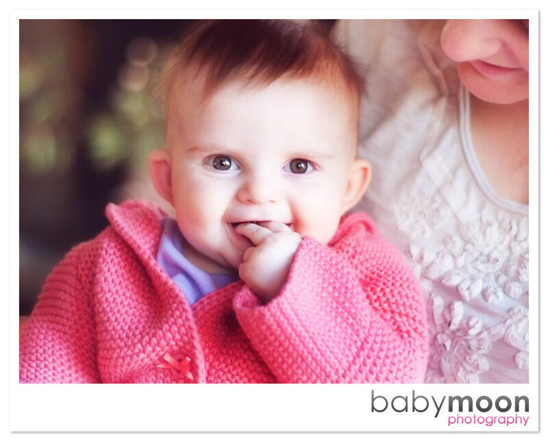baby in pink sweater
