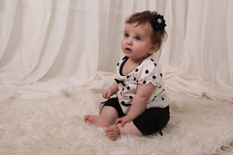 Baby in polka dot outfit