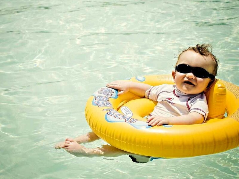 Baby in Pool Float — Yellow