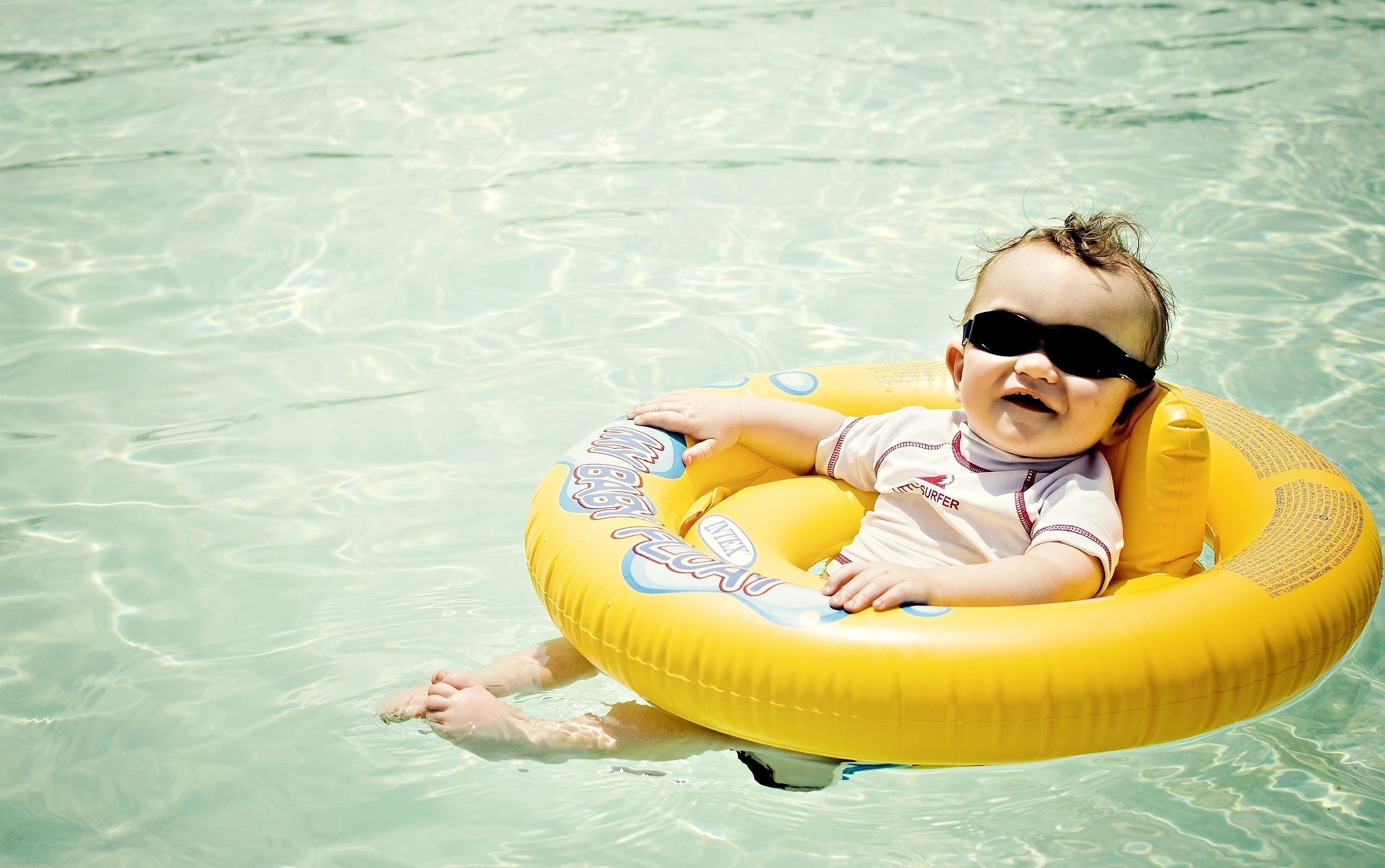 Baby in pool float