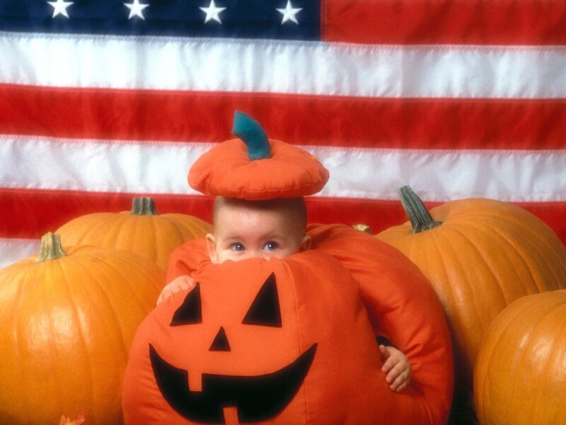 Baby in pumpkin costume