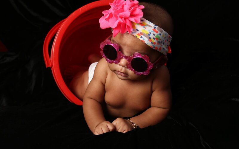 Baby in Red Bucket