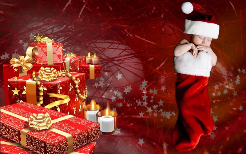 Baby in Santa hat with gifts