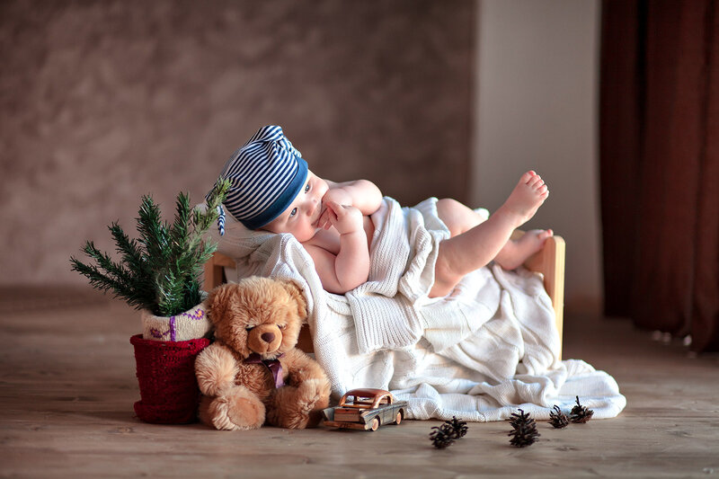 Baby in Striped Hat — Brown, Calm, Winter