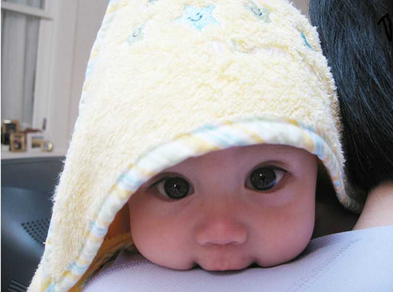 Baby in towel hood