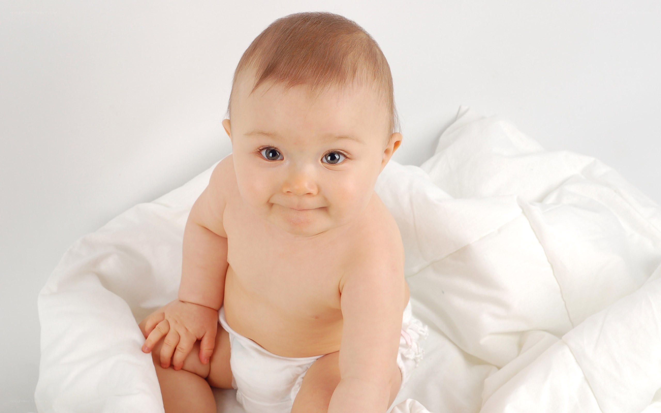 baby in white blanket