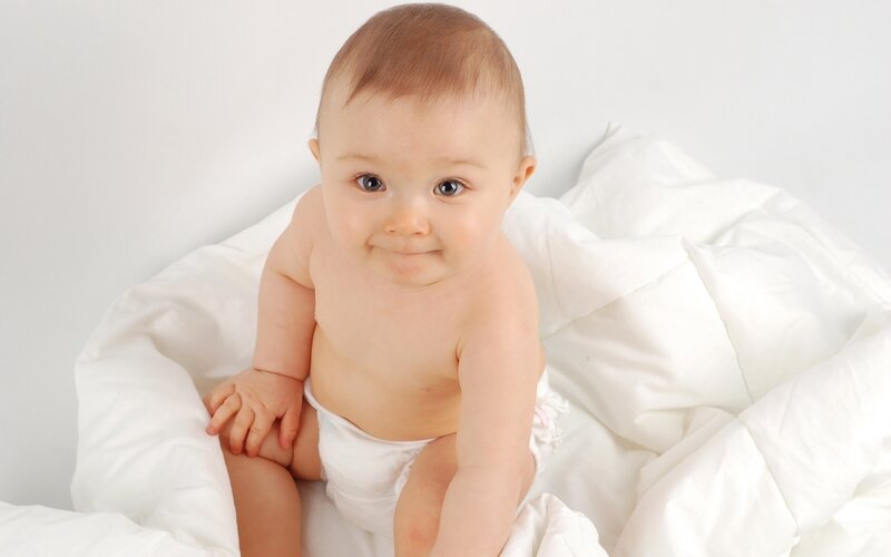 baby in white blanket