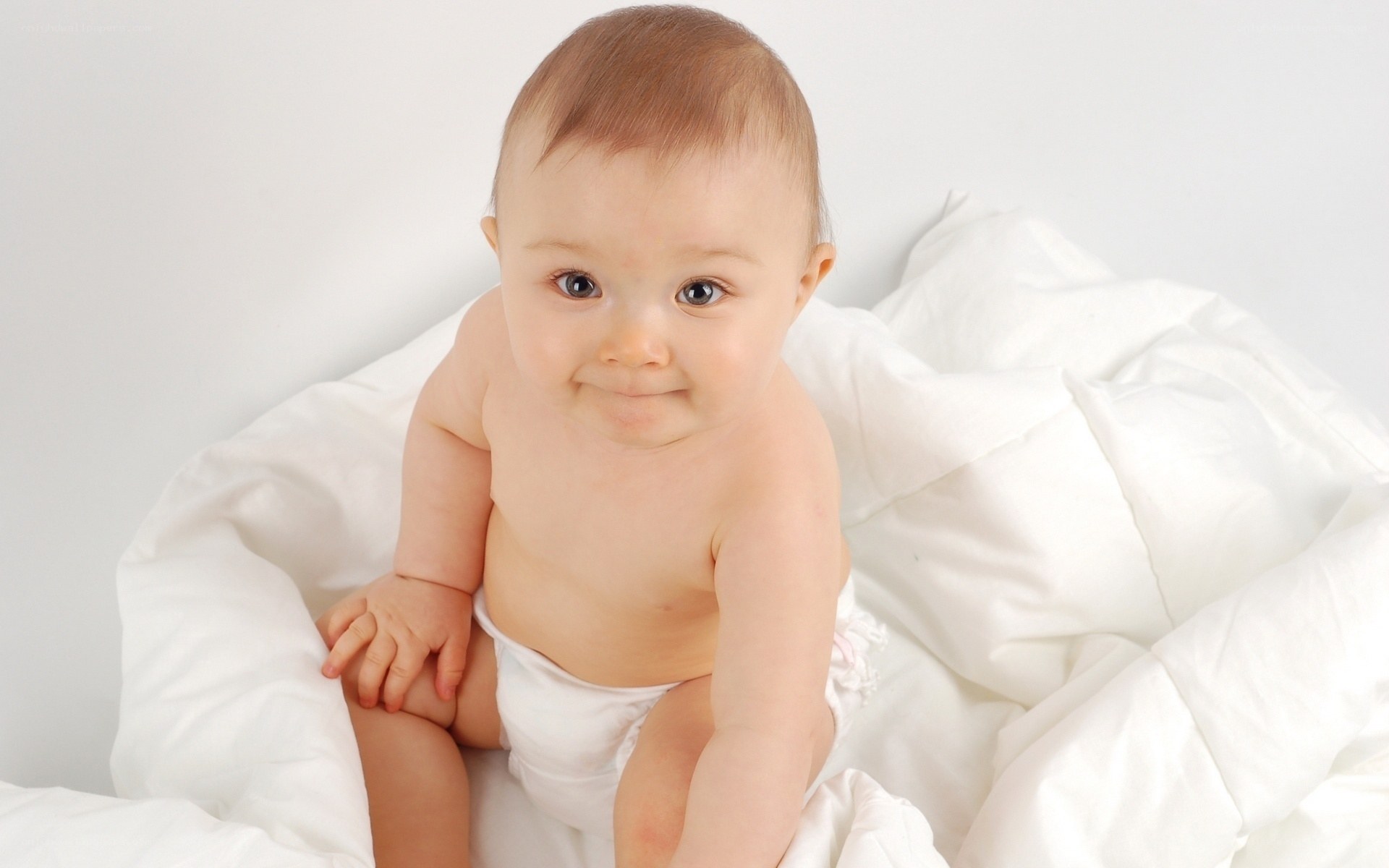 baby in white blanket