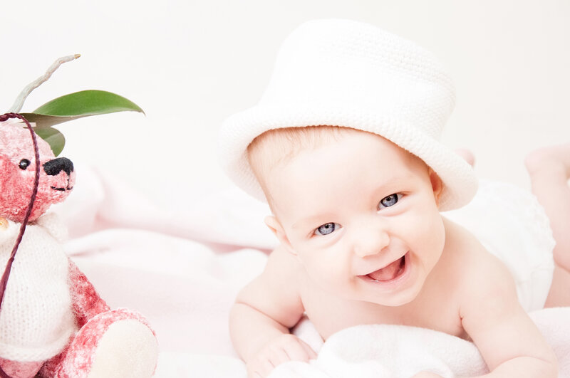 Baby in White Hat — Happy