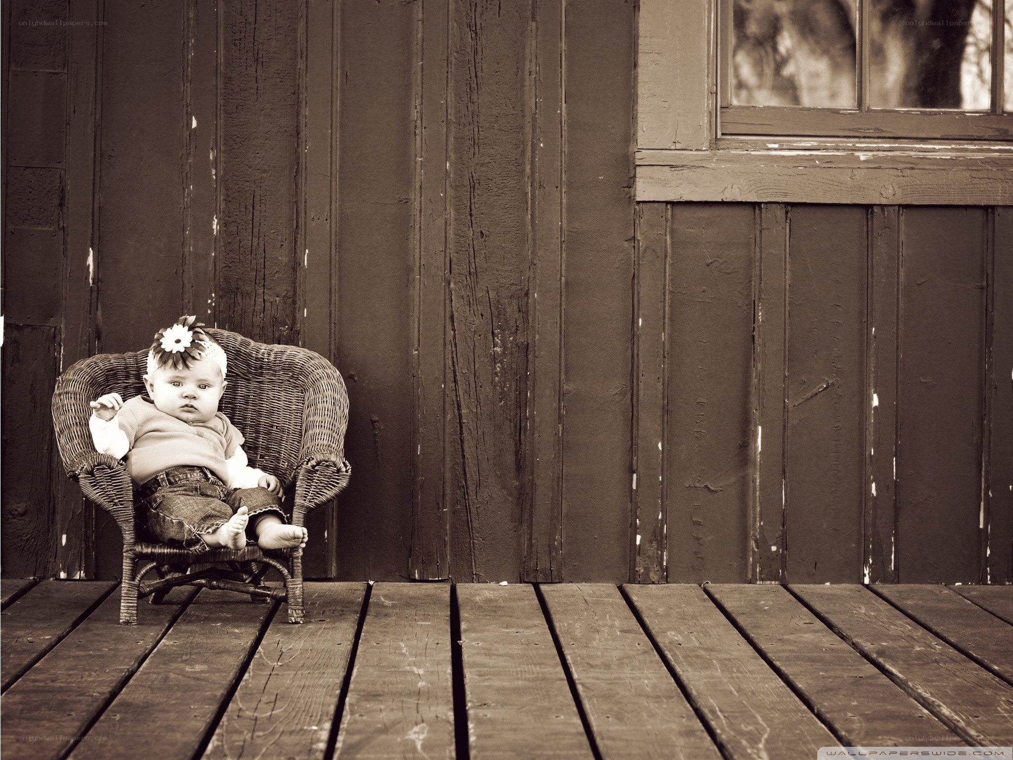 Baby in wicker chair