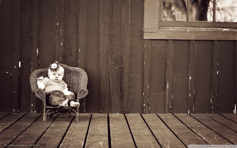 Baby in wicker chair