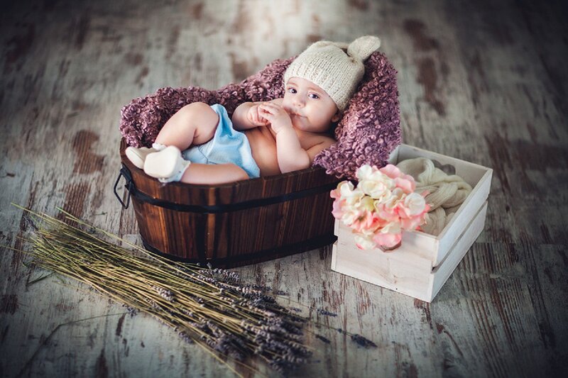 Baby in Wooden Basket