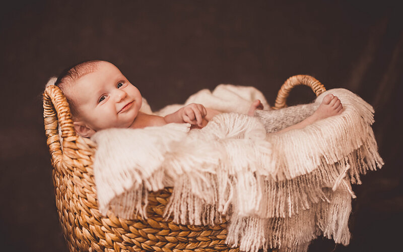 Baby in Woven Basket