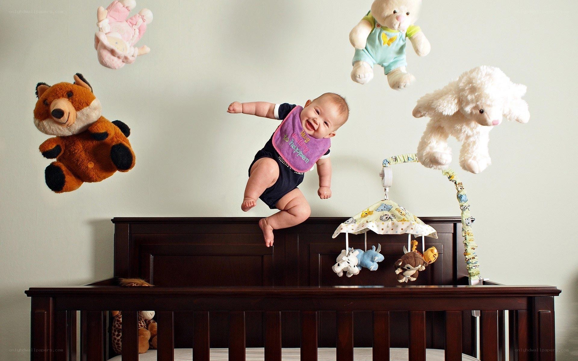 Baby jumping on crib