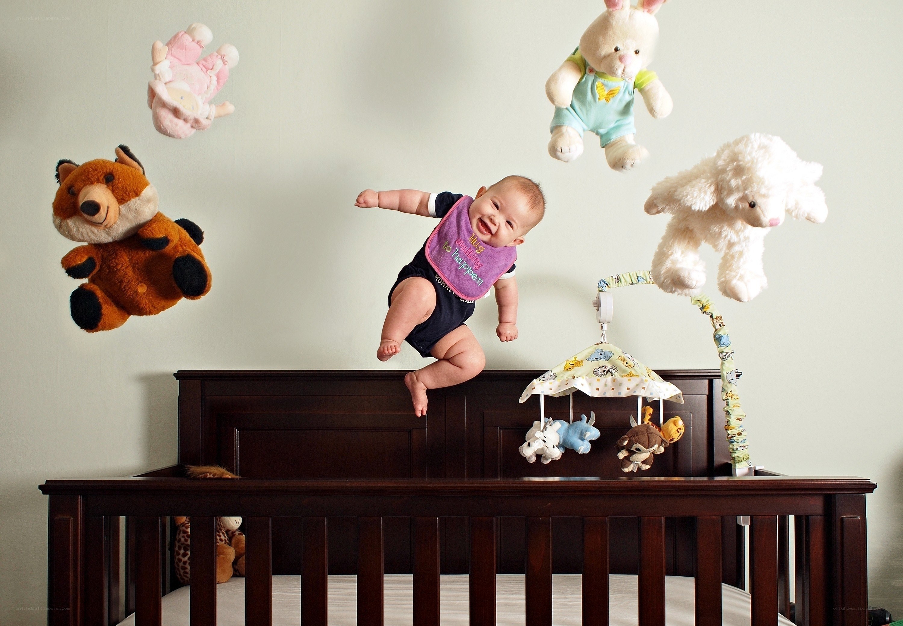 Baby jumping on crib