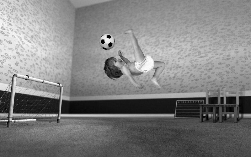 Baby Kicking Soccer Ball — Black