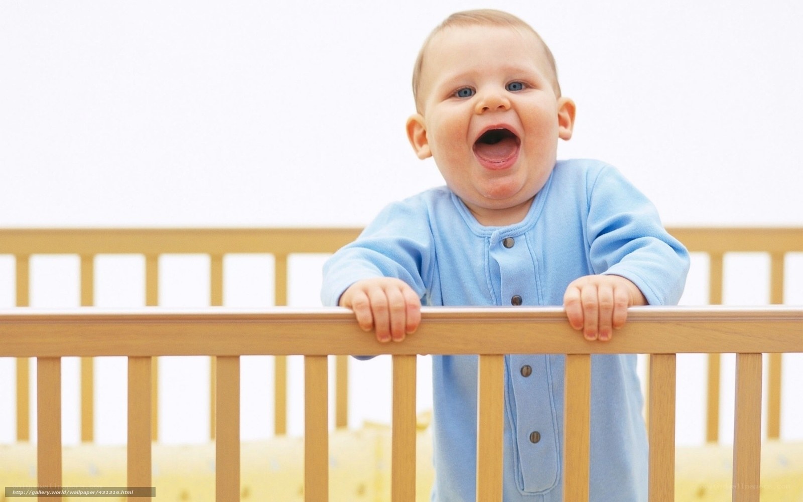 Baby laughing in crib