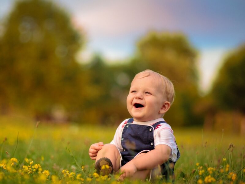 Baby Laughing in Field