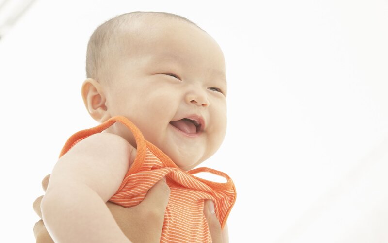 Baby Laughing in Orange