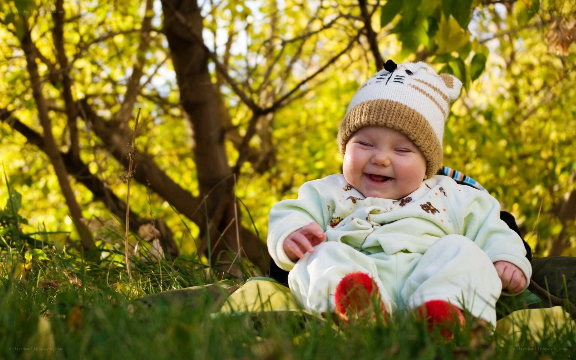 Baby laughing in park