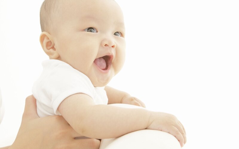 Baby Laughing in White
