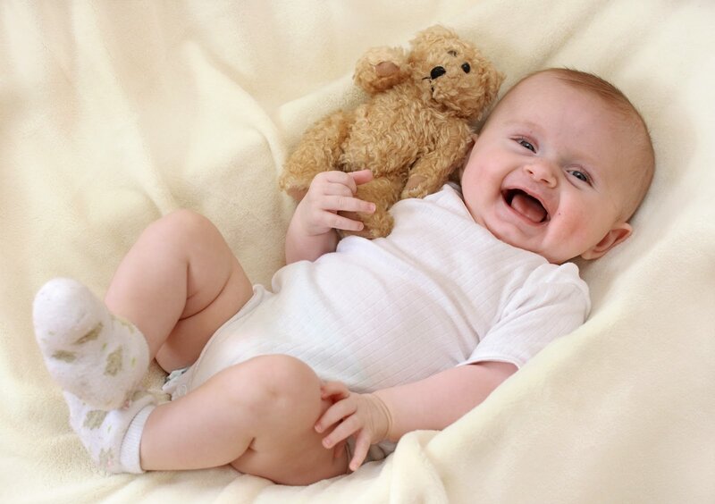 Baby Laughing with Teddy Bear