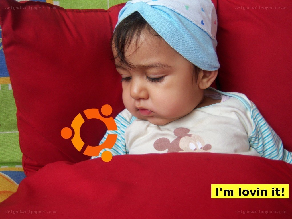 Baby loving Ubuntu logo
