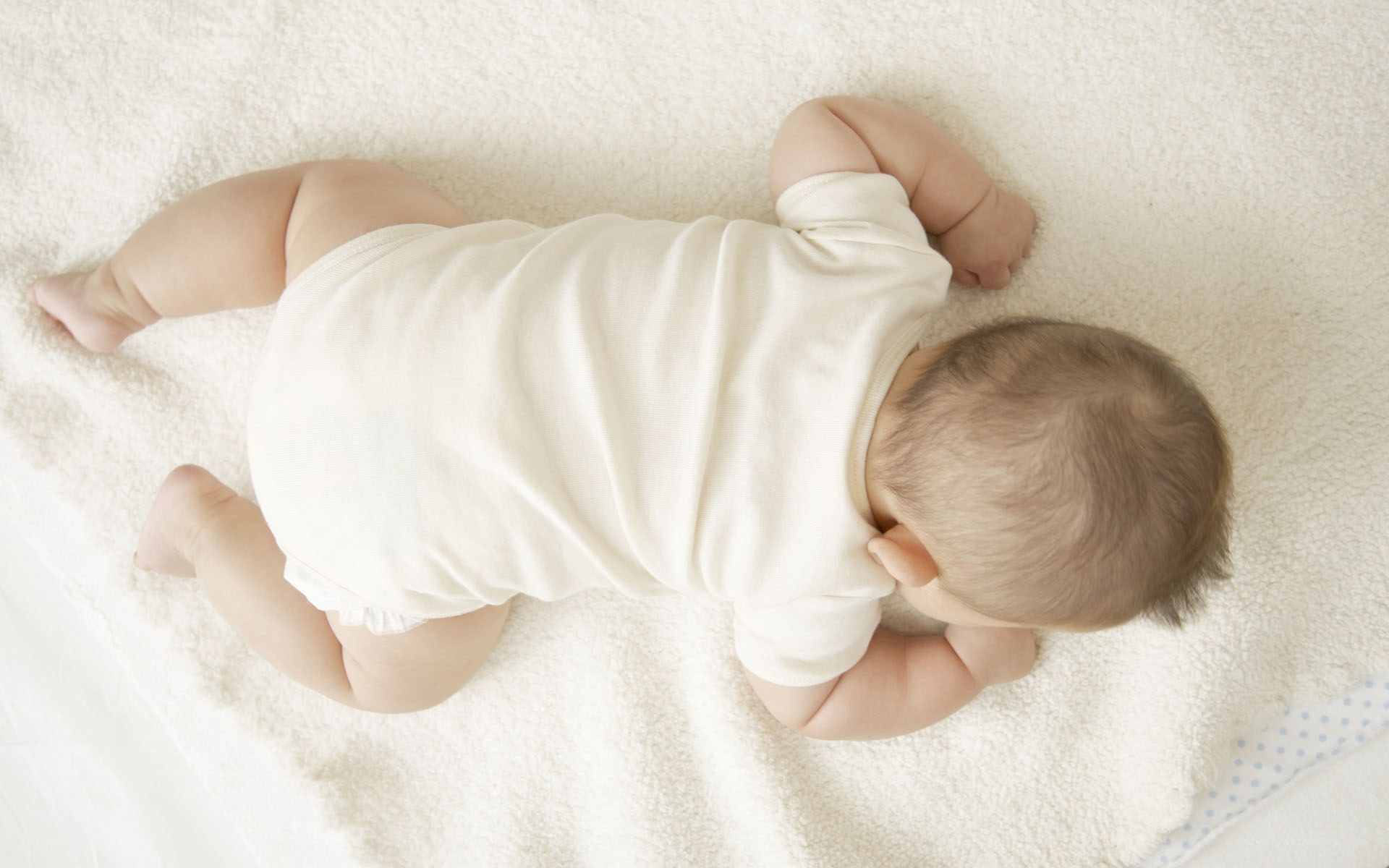 baby lying on back