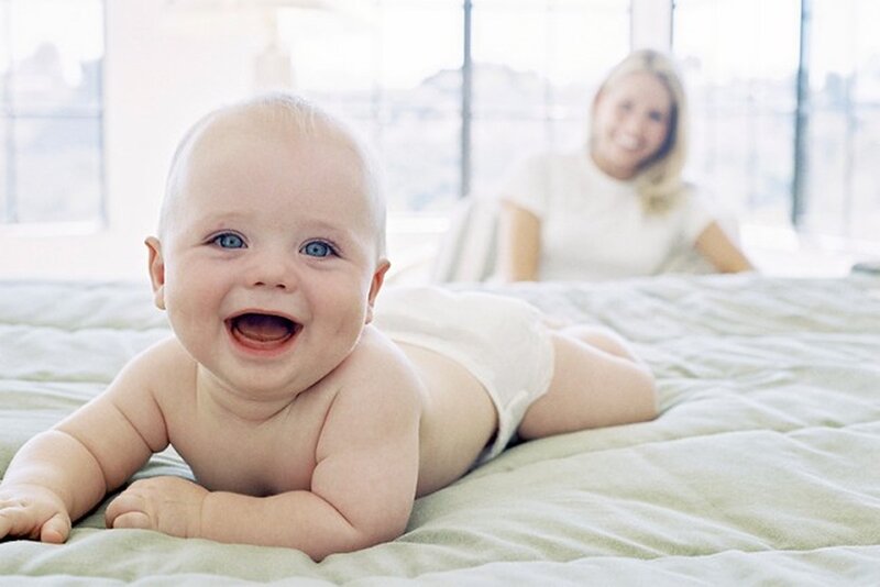 Baby Lying on Bed