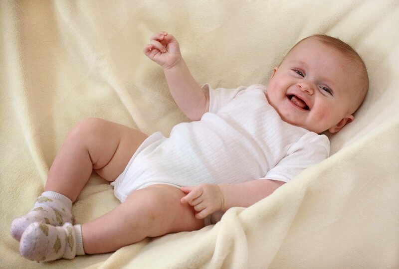 Baby Lying on Blanket — Cream
