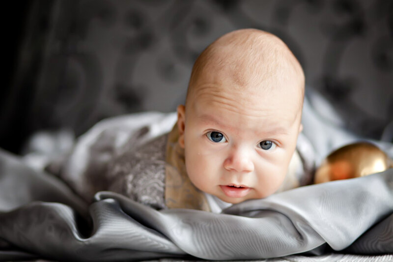 Baby Lying on Blanket — Gray