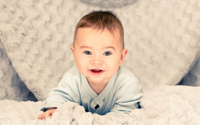 Baby Lying on Blanket — White, Calm