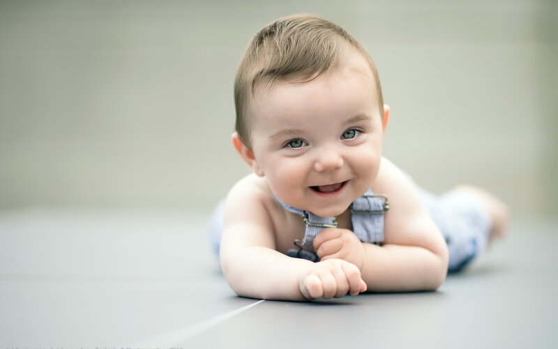 Baby Lying on Stomach — Gray, Calm